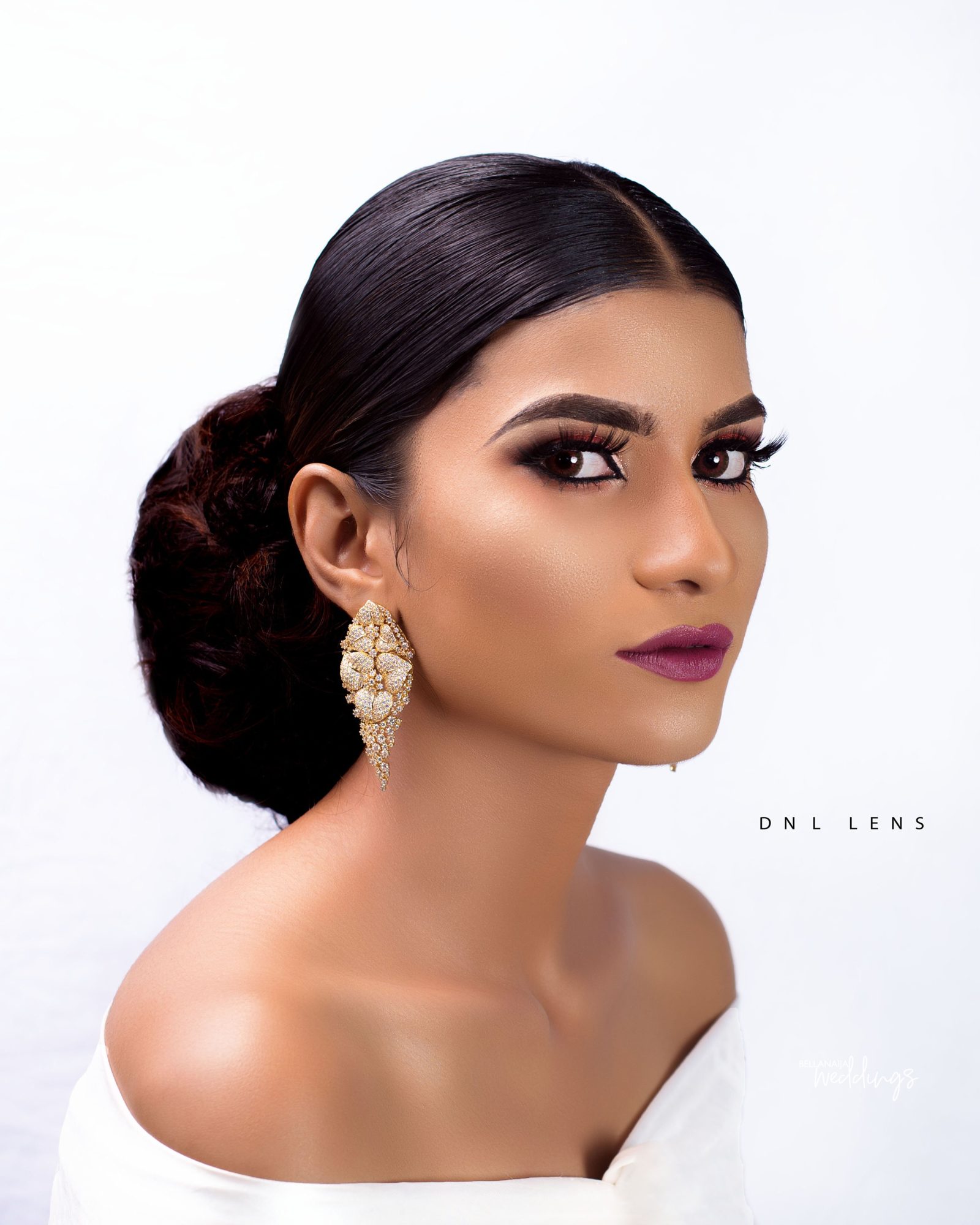 Classy Brides will Opt for a Curly Low Back Bun Hairstyle