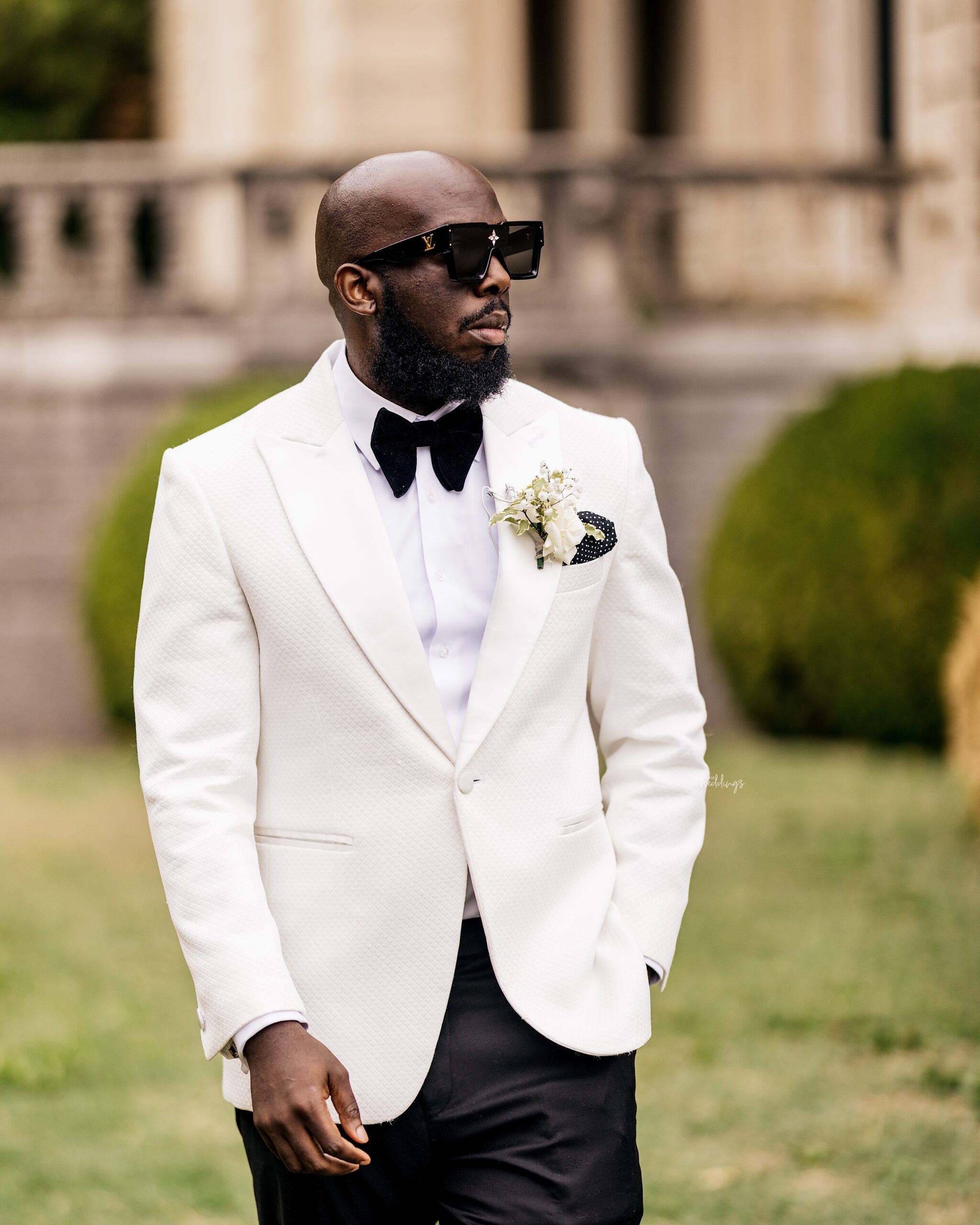 Premium Photo  A man wearing a white shirt and black pants stands in front  of a white door